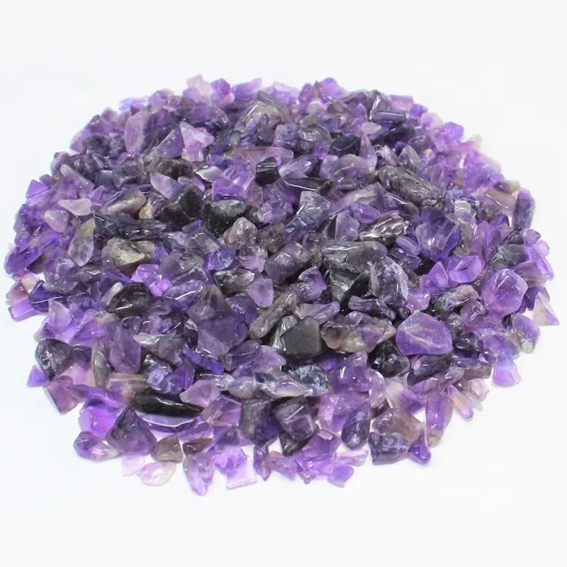 A pile of purple and grey tumbled gemstone chips for crafts and jewelry making