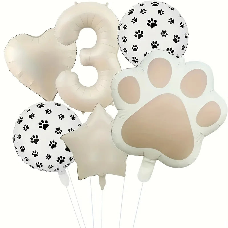 A set of six foil balloons featuring paw prints and the number three in white and beige colors.