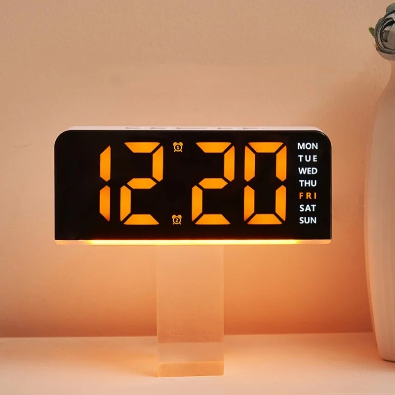 A black digital alarm clock displaying 12:20 on a light-colored surface.