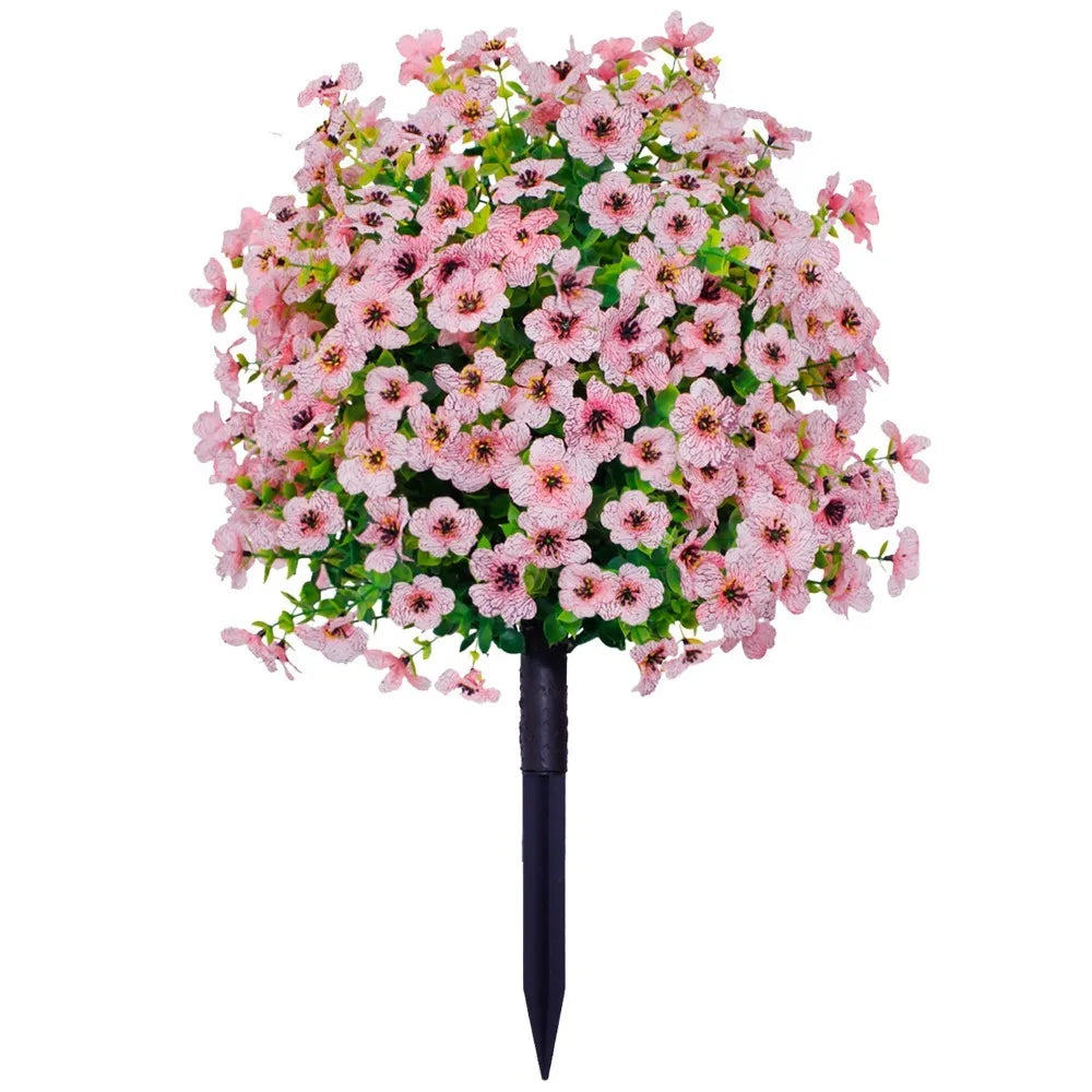 A dense bouquet of pink and green artificial eucalyptus violet flowers.