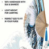 A foldable Japanese hand fan featuring a Kanagawa wave design made from silk and bamboo.