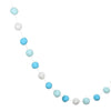 A string of colorful felt balls in shades of blue and white used for home decor.