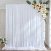 White satin backdrop curtain with vertical pleats and floral greenery for parties and photography