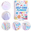A colorful self-care planner notebook with stickers and illustrations for daily happiness tracking.