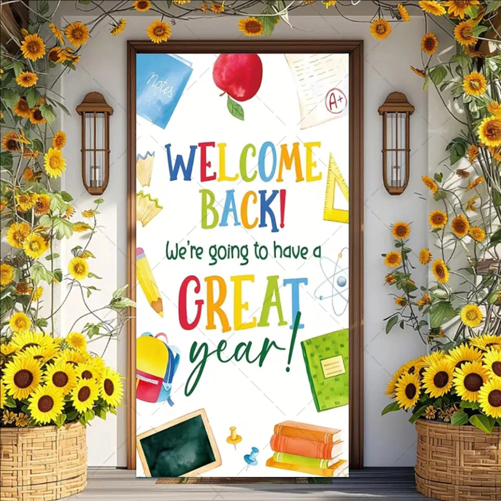 A colorful vinyl backdrop banner featuring text 'WELCOME BACK! We're going to have a GREAT year!' surrounded by flowers and s