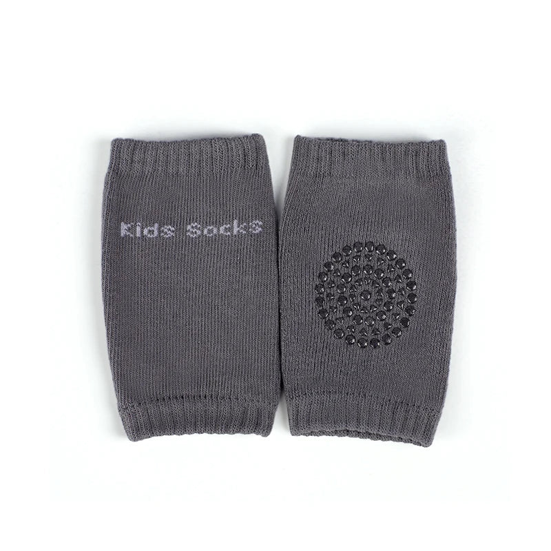 A pair of gray knitted baby socks with a textured pattern.