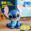 A blue Lilo & Stitch character speaker with pink ears sitting on a wooden surface.