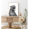 A framed canvas print of a leopard's head in black and white against a white background.