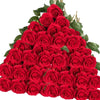 A dense bouquet of vibrant red velvet artificial roses for weddings and home decor.