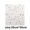 White foam wall panels with scattered black and orange stars and dots for home decor