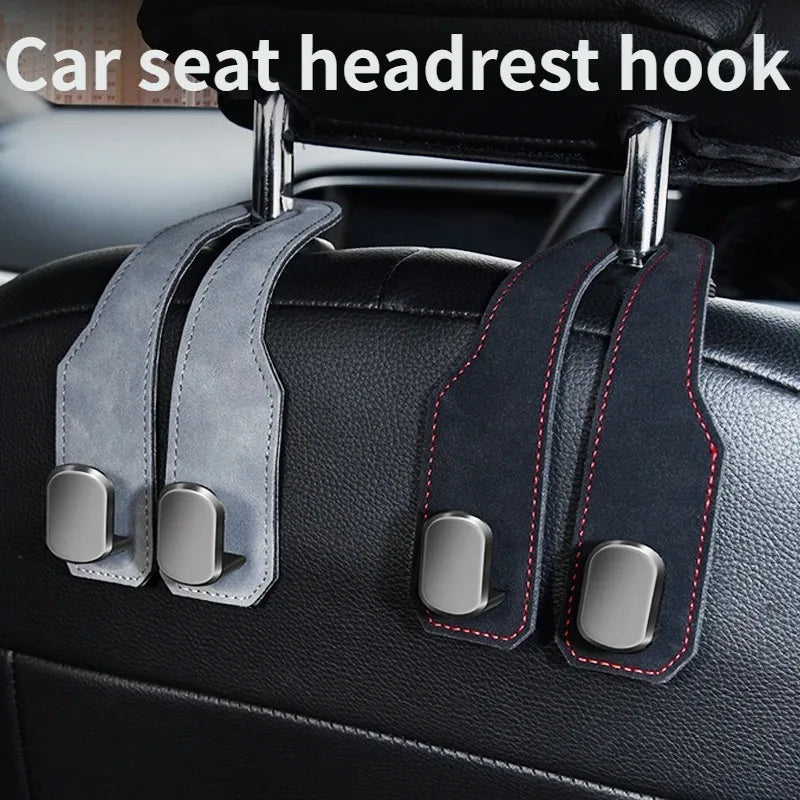 Car seat headrest hook organizer with dual alloy hooks attached to a black car seat.