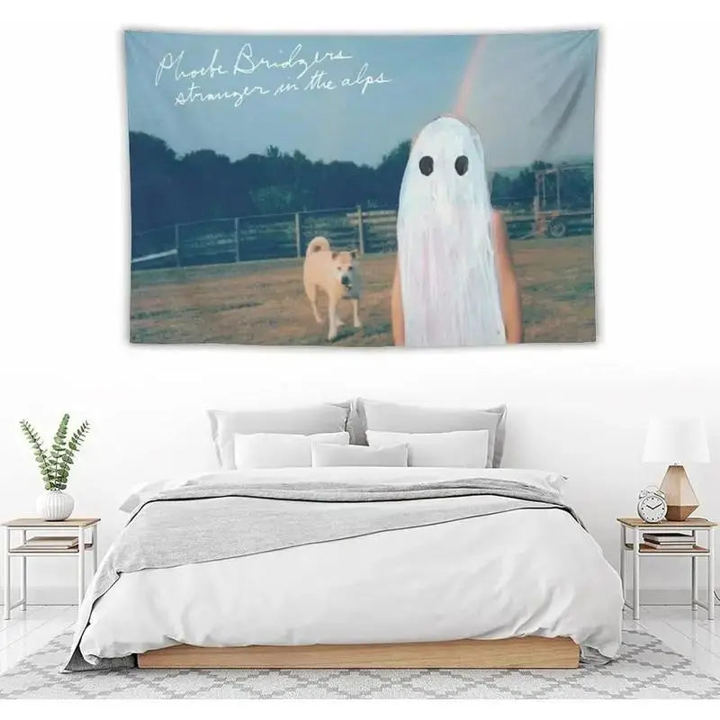 A wall tapestry featuring a ghostly figure in a snowy landscape with text reading Prove Bridgers stranger in the alps