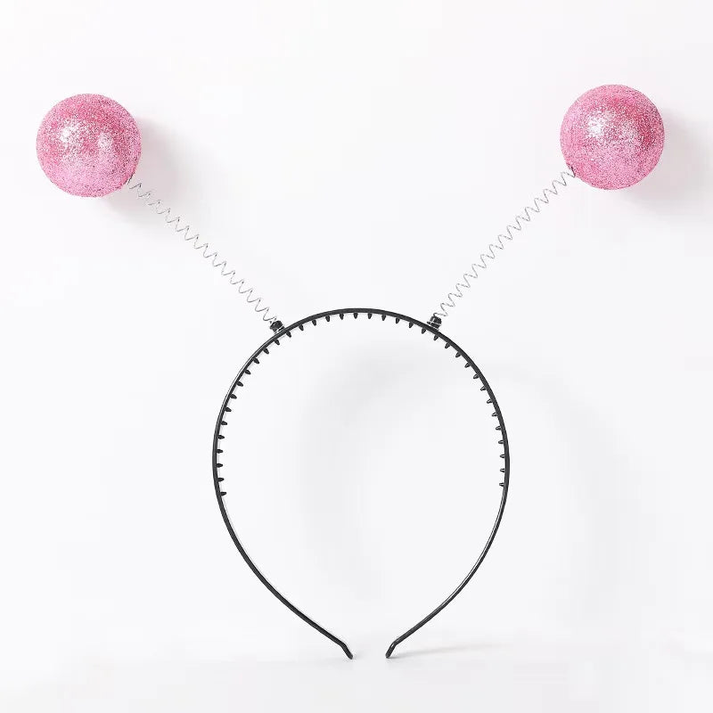 A pair of pink glittery rainbow alien sunglasses with UV400 protection displayed against a white background.