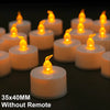 A row of glowing white LED tea light candles with yellow flames on a dark surface.