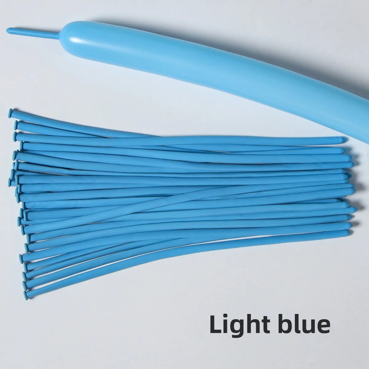 A bundle of light blue latex strip balloons and a single balloon are shown against a white background.