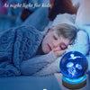 A blue 3D jellyfish crystal ball night light illuminating a child in a cozy setting.
