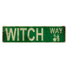 Vintage metal sign with green background and white text reading WITCH WAY featuring a silhouette of a witch.