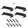 Four black wall mount display holders for die-cast car models and several small screws.