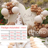 A beige and white balloon garland featuring round balloons, a tiered cake, and dried grasses for an event decoration kit.