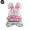 A pink and white foil balloon shaped like a bunny with long ears, celebrating Easter.