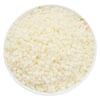 A bowl filled with white natural soy wax flakes for DIY candle making