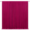 A vibrant magenta pleated fabric backdrop used as elegant drapery for events.