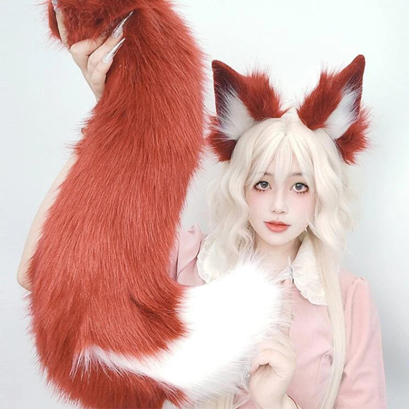 A woman wearing a pink outfit holding a large, reddish-orange faux fur fox tail and ear costume set.