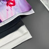 Close-up of customizable printed fabric flags and banners in purple, pink, and white colors.