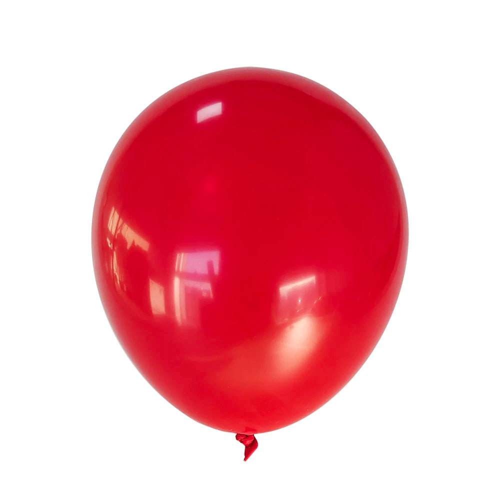 A single, glossy red latex balloon against a white background.