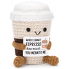 A handmade plush knitting doll with light beige yarn skin and brown knitted arms and legs.