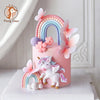 Pink unicorn theme cake topper set featuring a rainbow arch and pink butterfly decorations