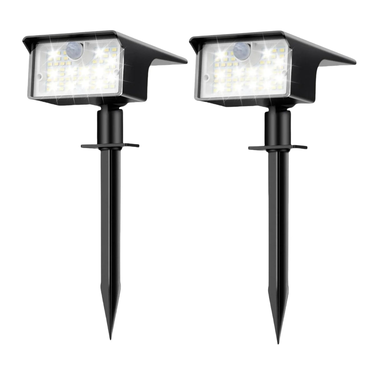 A pair of black solar powered motion sensor spot lights with LED illumination.