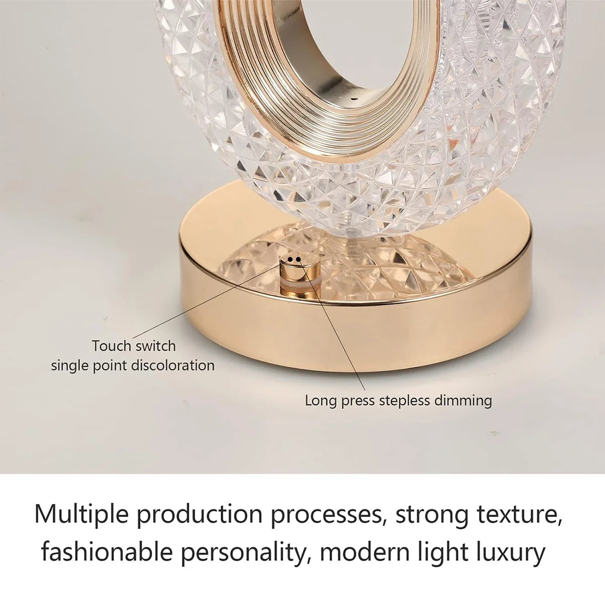 A modern crystal table lamp with a gold base and clear glass shade featuring touch switch and long press dimming controls.