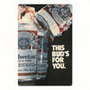A vintage beer metal sign set featuring a bottle and a bud, used for bar or pub decor.