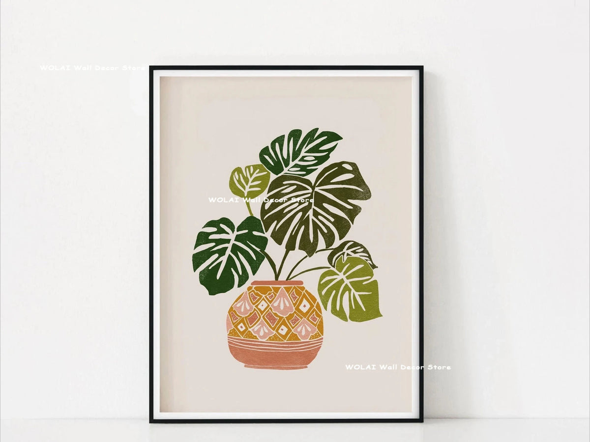 Botanical philodendron canvas wall art featuring a green plant in an orange patterned pot.