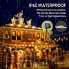 Outdoor house decorated with warm fairy string lights during a rain shower, emphasizing IP65 waterproof protection.