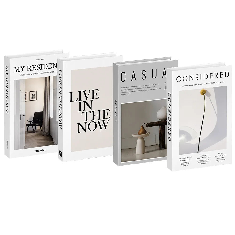 A set of three decorative faux books titled My Residence Live in the Now Casual and Considered for home decor