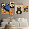 A gallery wall featuring abstract music canvas art depicting a guitar, cello, and piano in black and yellow tones.