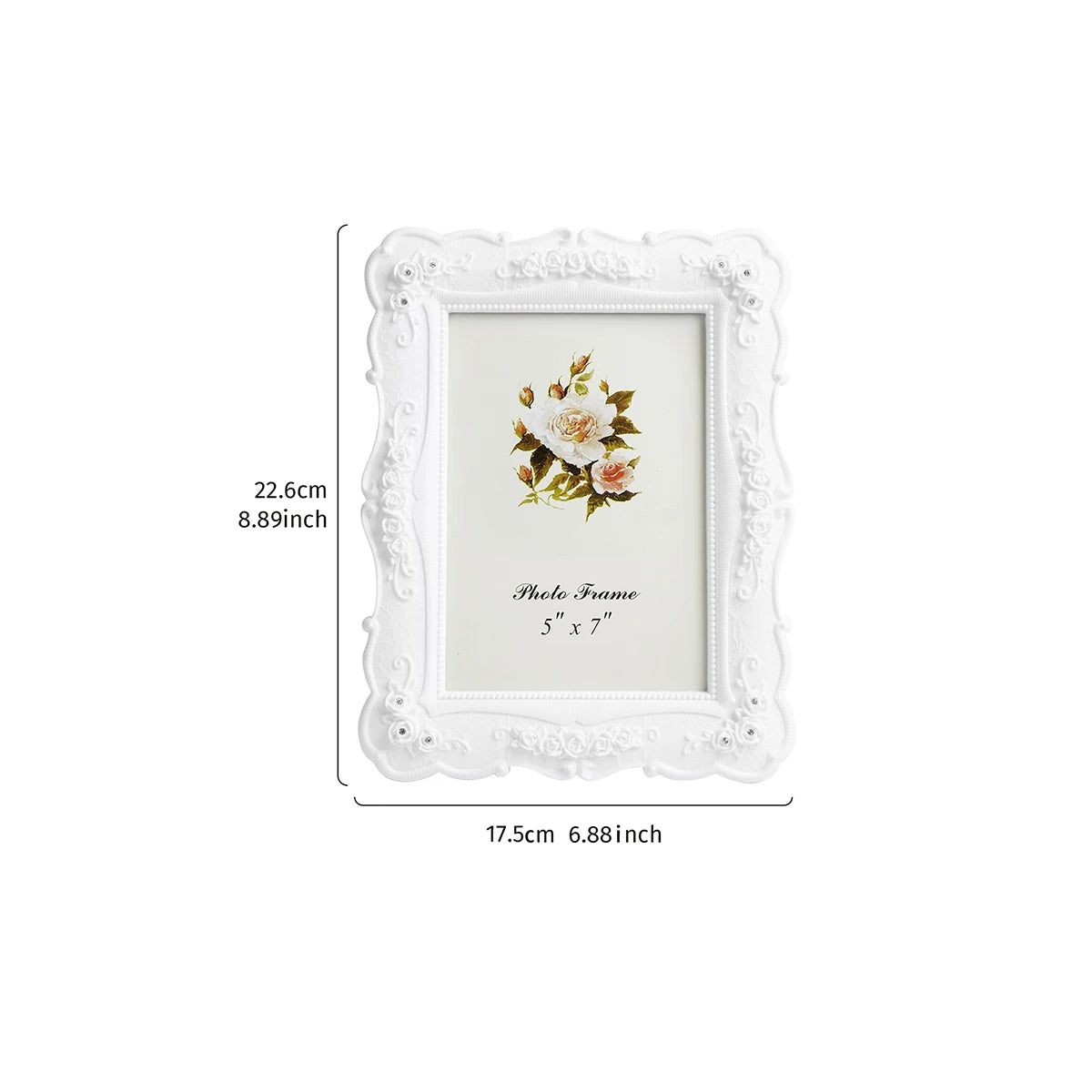 White ornate photo frame with a floral design and a white mat.