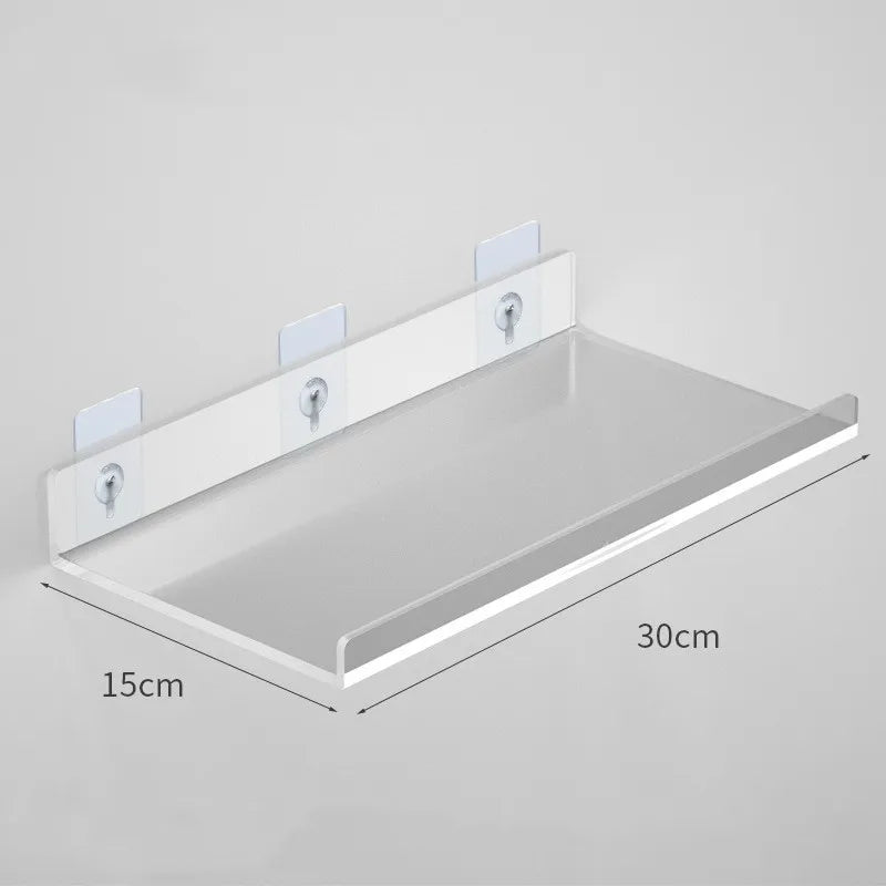 Clear acrylic floating shelf with wall mounts shown from above, measuring 30cm by 15cm.
