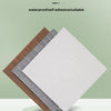 A display of multiple colors of waterproof self-adhesive cuttable foam wall panels stacked on a green pedestal.