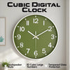 A round, minimalist wall clock with a green face and white hands displaying the time.