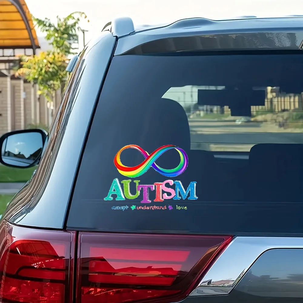 A dark car window features a rainbow infinity symbol and the word AUTISM in colorful lettering.