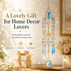 A crystal prism suncatcher with a gold geometric frame hanging in a light-filled room.