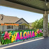 A vibrant tropical floral banner with the word ALOHA displayed on a wooden deck under an overhang.