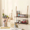 A rustic floating wooden storage shelf displaying various decorative items and a small red toy car.
