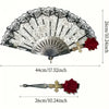Vintage flamenco rose handheld folding fan with black and white floral patterns and gold accents