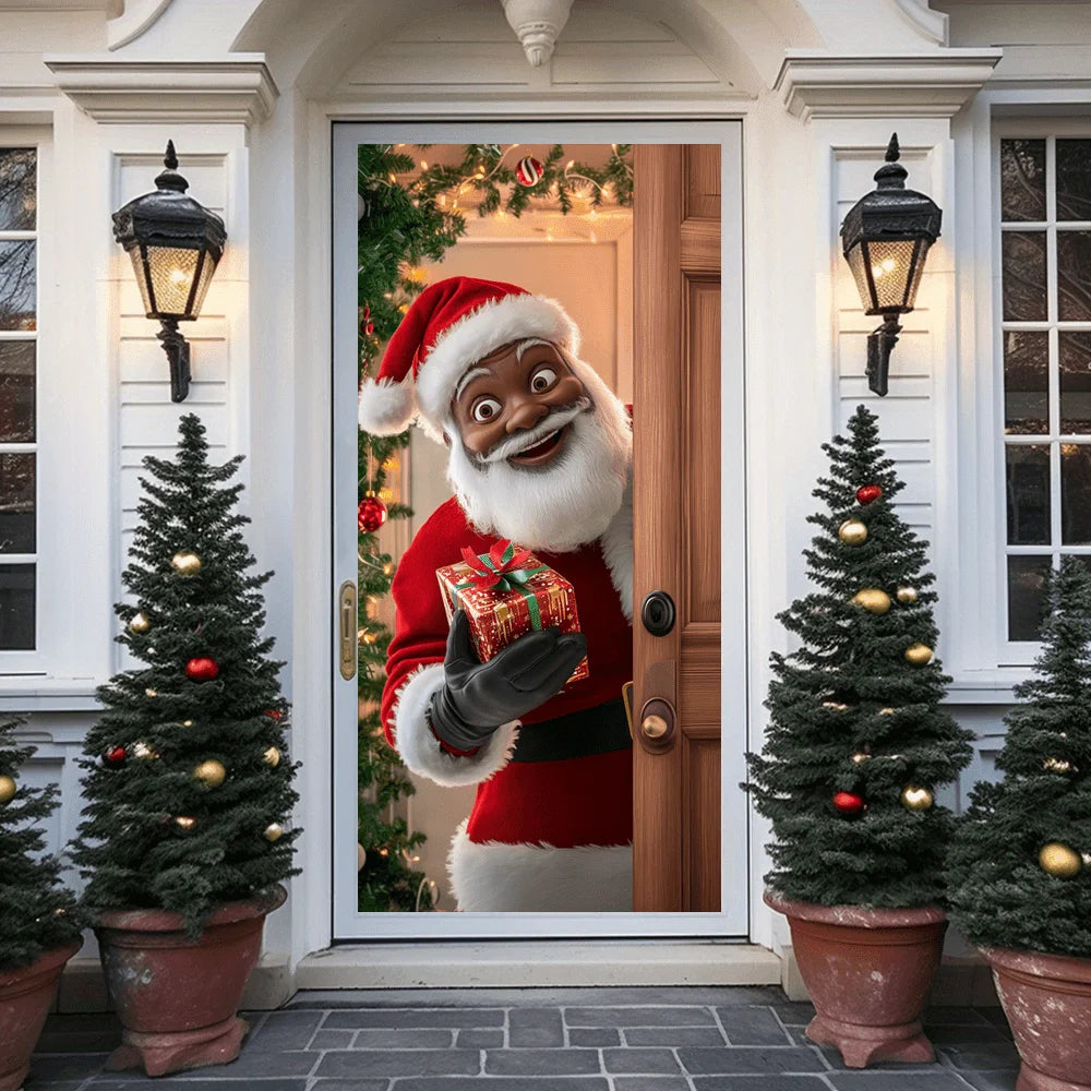 A festive display featuring a Santa figure in a red suit and beard framed by Christmas trees and an ornate door.