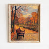 Oil painting of an autumn field landscape featuring trees and a wooden bench.
