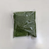 A clear plastic bag filled with green artificial moss for home decor and DIY projects.